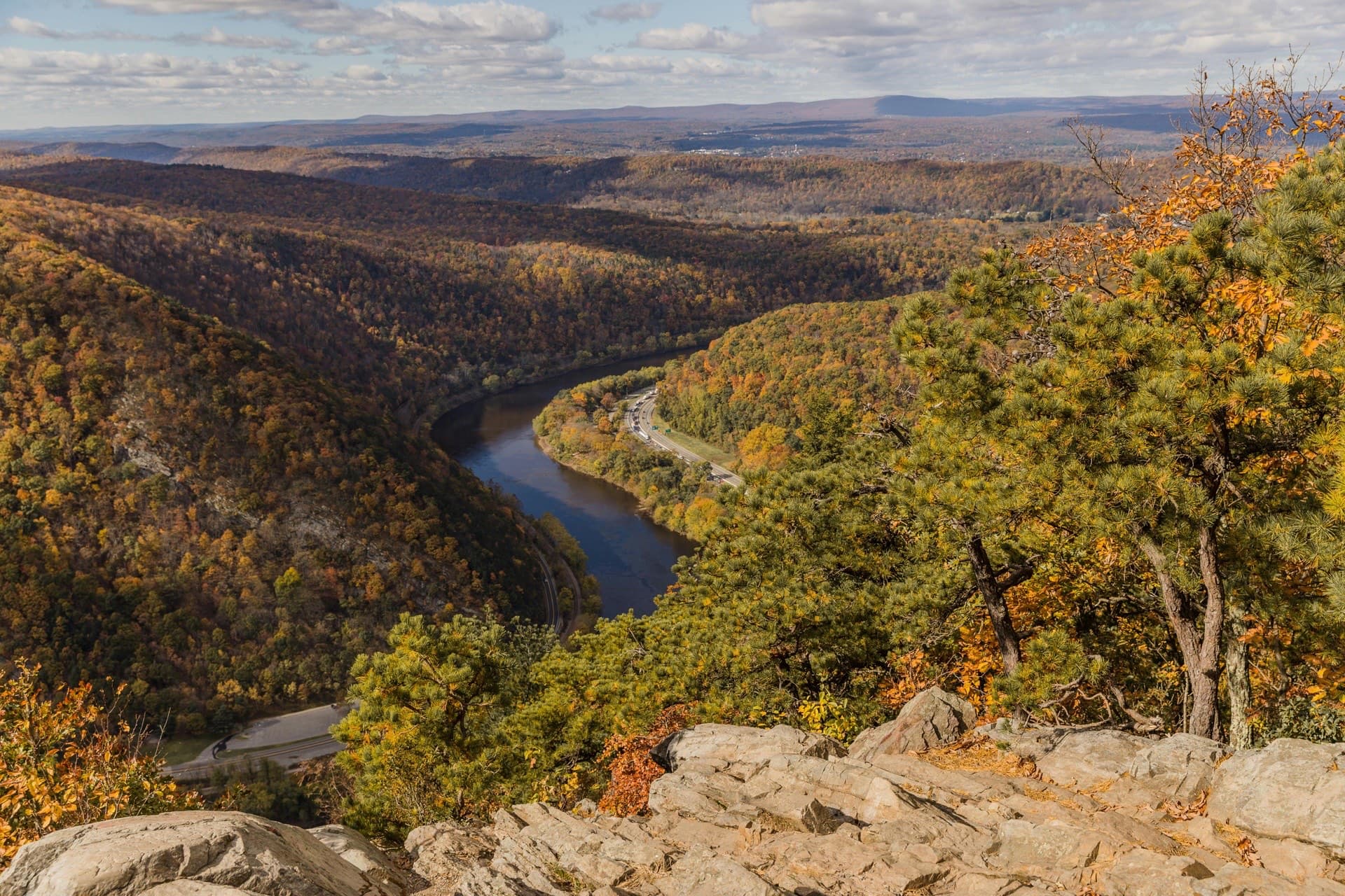 A wide river valley landscape under open sky